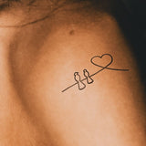 Schwalben und Herz Tattoo