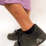 Kleine Blume Tattoo